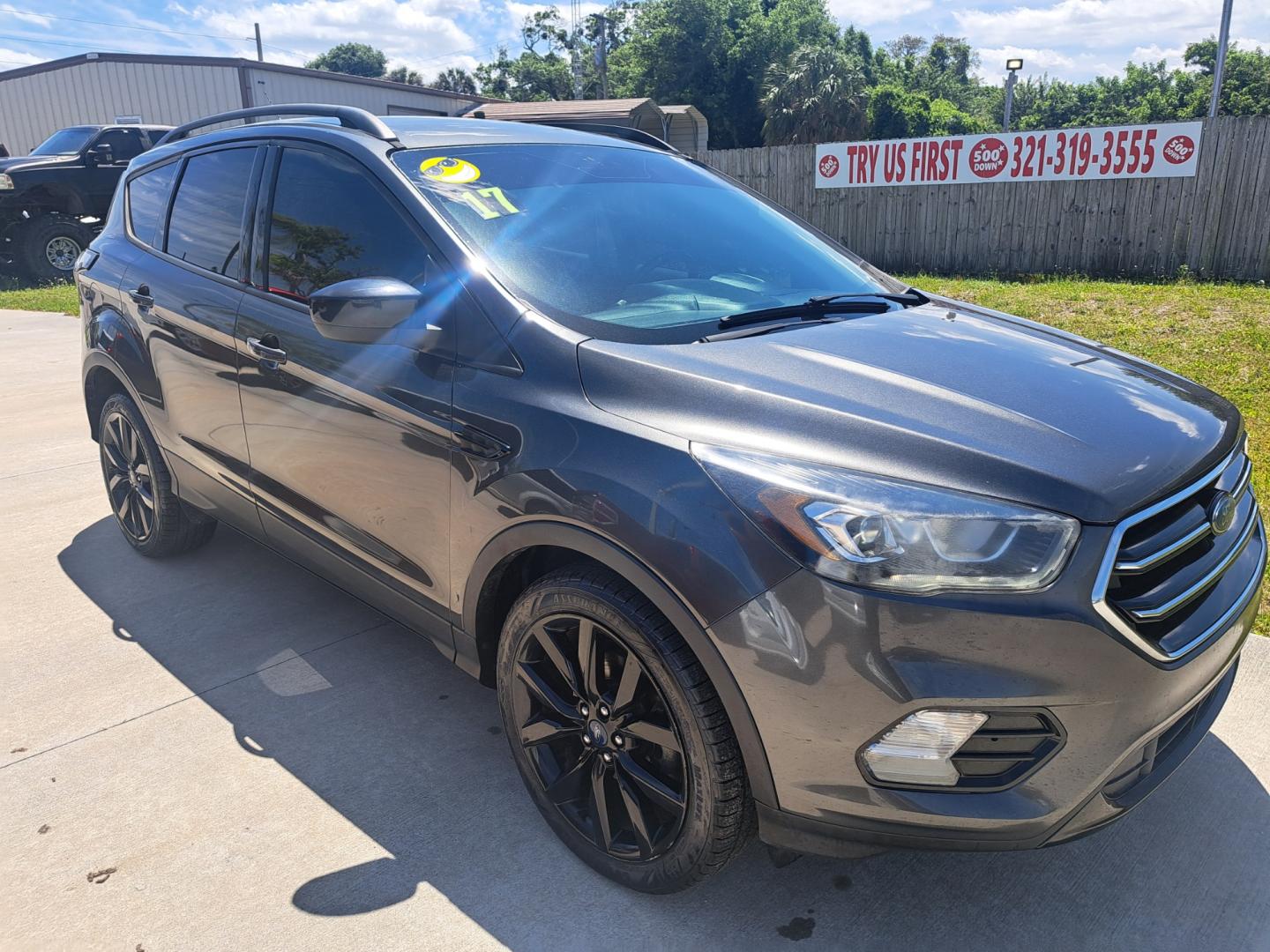 2017 Grey /GRAY Ford Escape (1FMCU0GD8HU) , located at 1181 Aurora Rd, Melbourne, FL, 32935, (321) 241-1100, 28.132914, -80.639175 - Photo#1